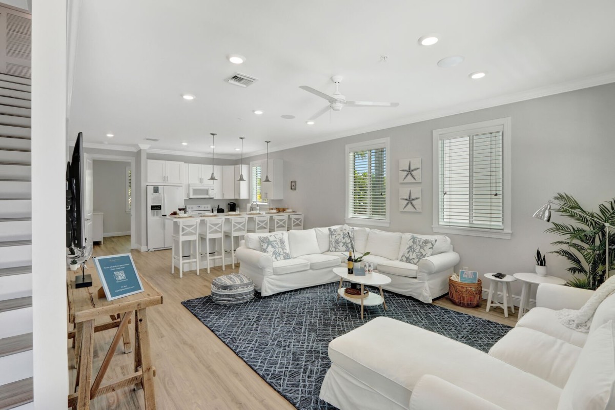 Living Room | Open concept, white and bright coastal design with ample seating.